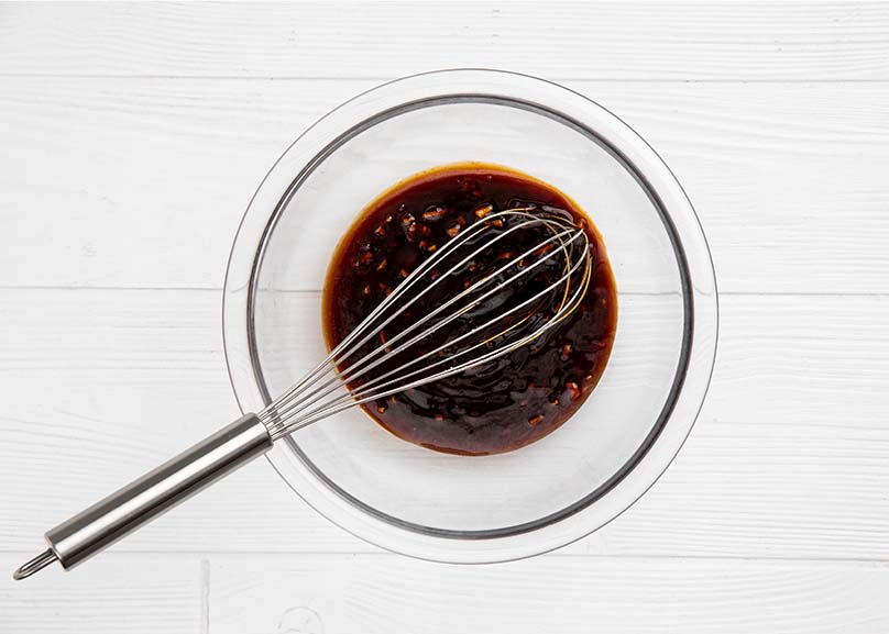 Whisk, Mixing Bowl with Ingredients for Honey-Garlic Glaze