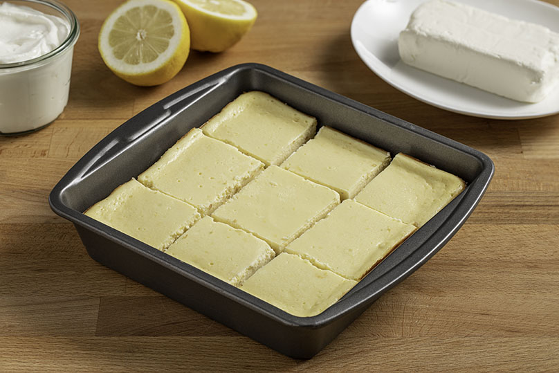 Bars cut into squares in baking pan