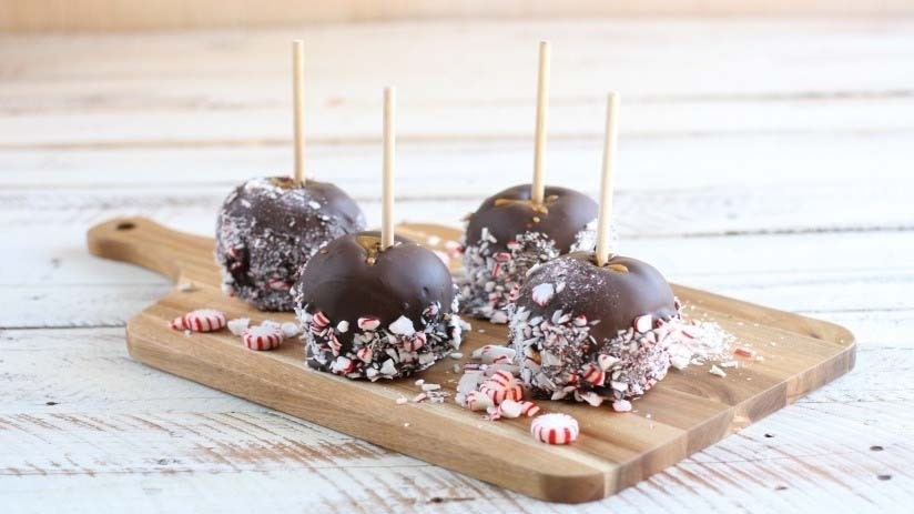 Peppermint Candied Apples on cutting board, wood table