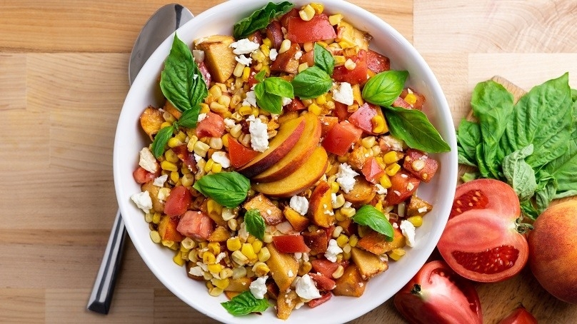 Grilled Peach Corn Tomato Salad, Tomatoes, Basil Leaves, Toamtoes, spoon, wood counter