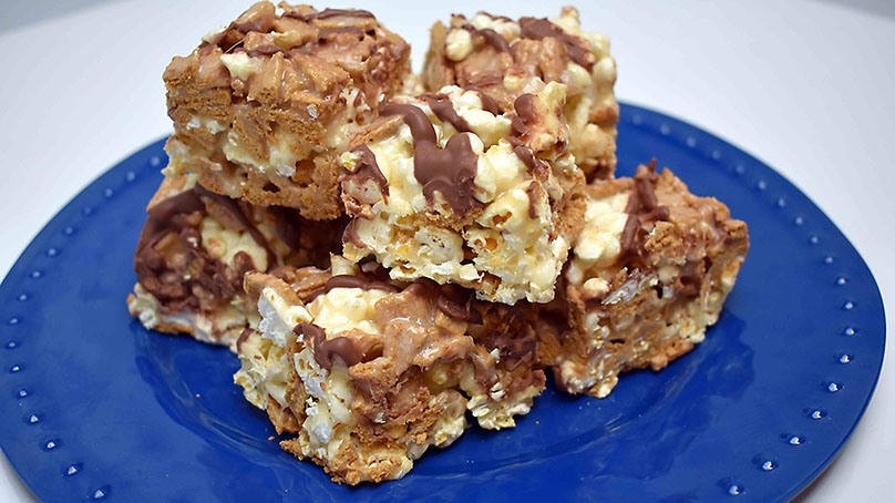 Stacked S'Mores Popcorn Treats on blue plate