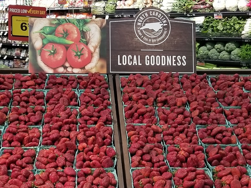 Strawberries in produce section, local goodness