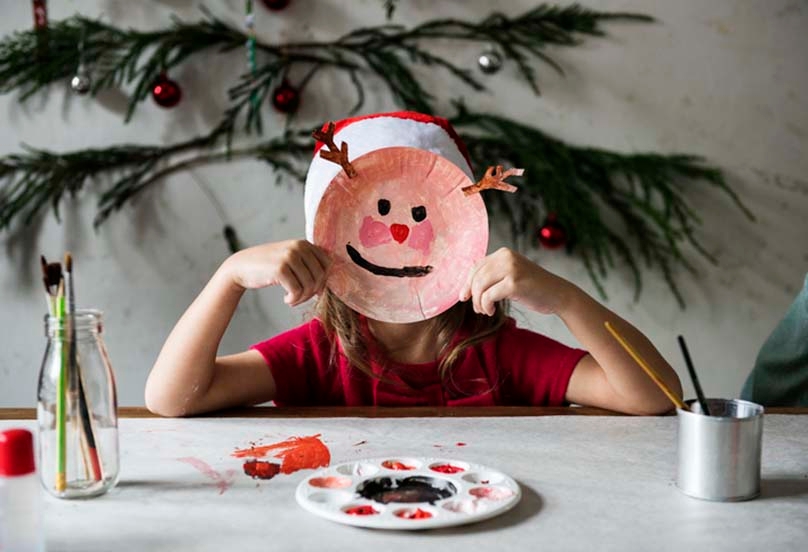 Girl Holding Homemade Reindeer Paper Plate