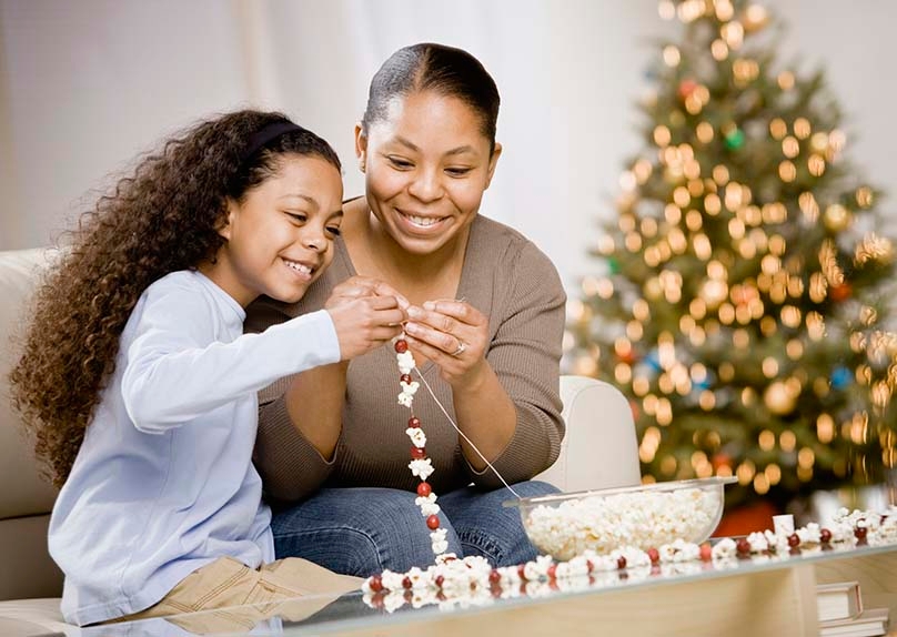 Mother & Daughter Making Popcorn Garland