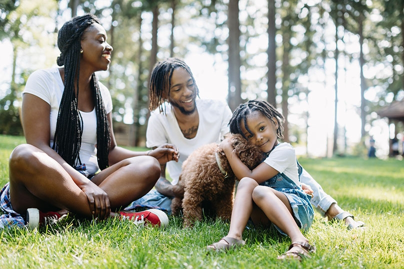 Happy Family with Dog Outside