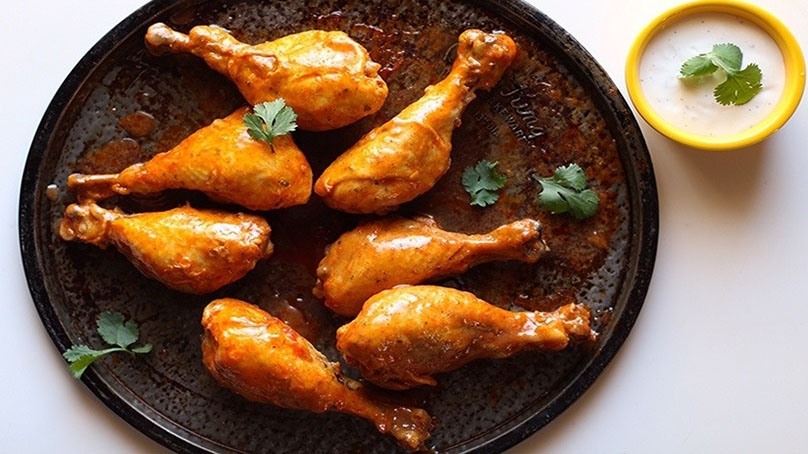Buffalo Ranch Slow Cooker Drumsticks on serving tray with dipping sauce in small bowl