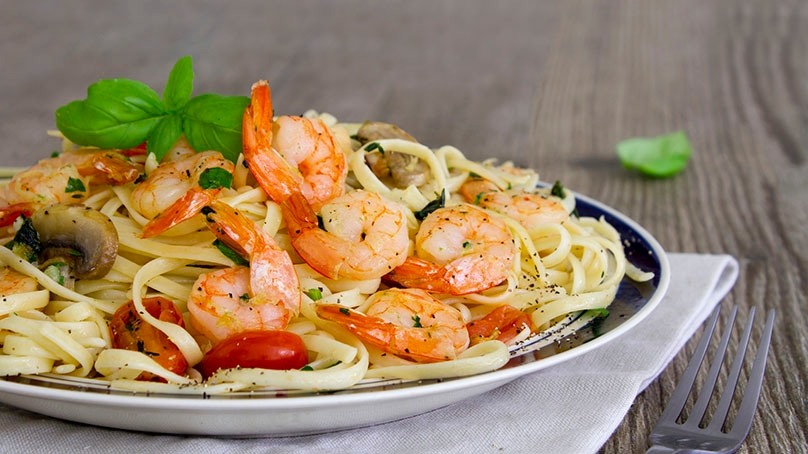 Spaghetti With Shrimps Parsley And Garlic In A Cooking Pan