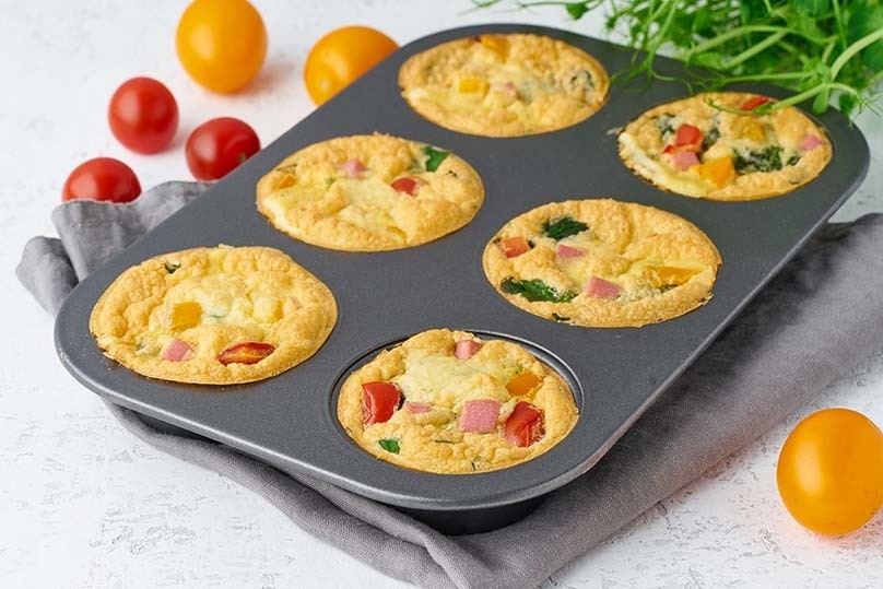 Egg muffins in muffin tin with tomatoes, Low Carb Meal, napkin, light counter top