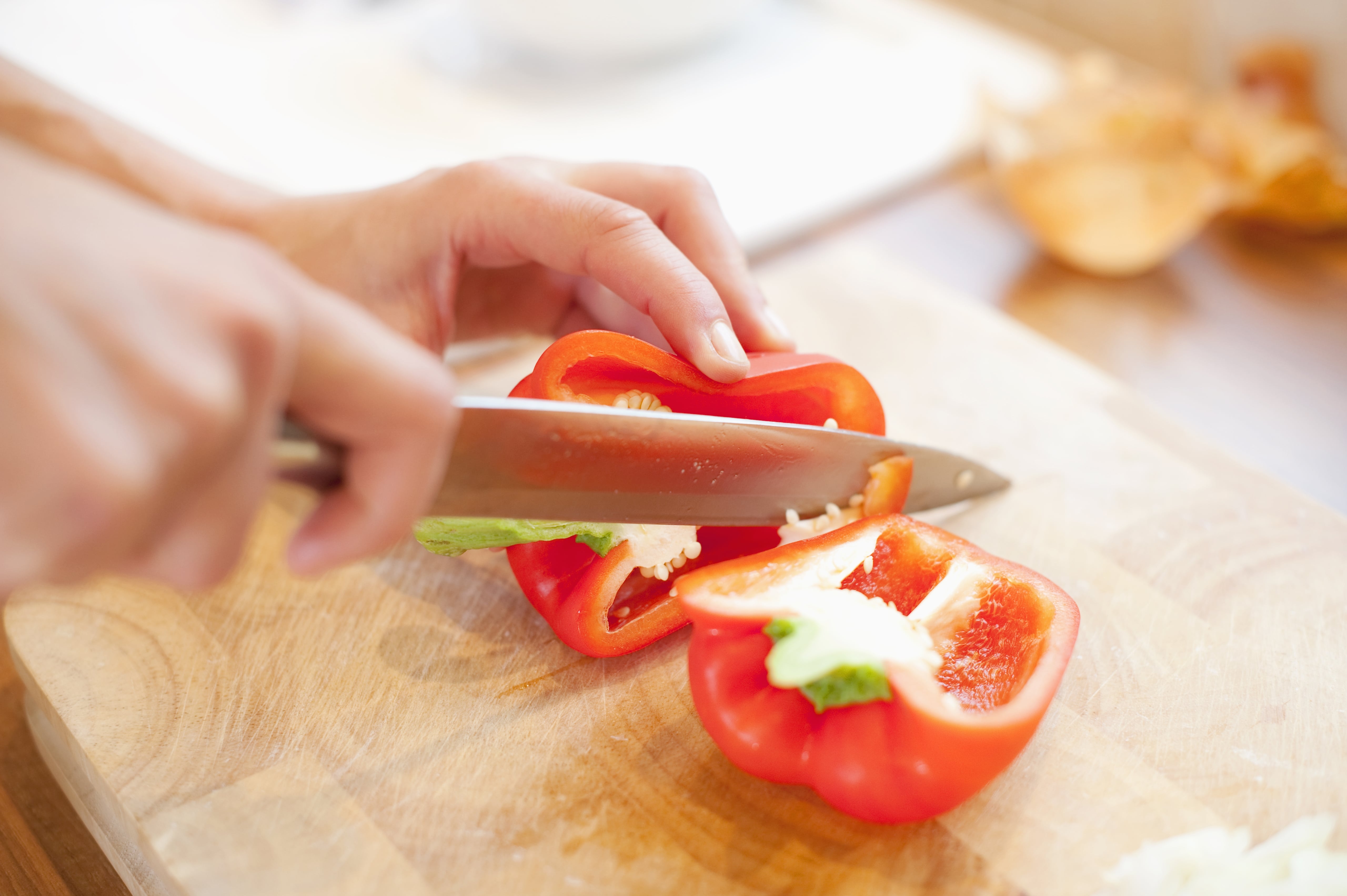 woman cutting peppers