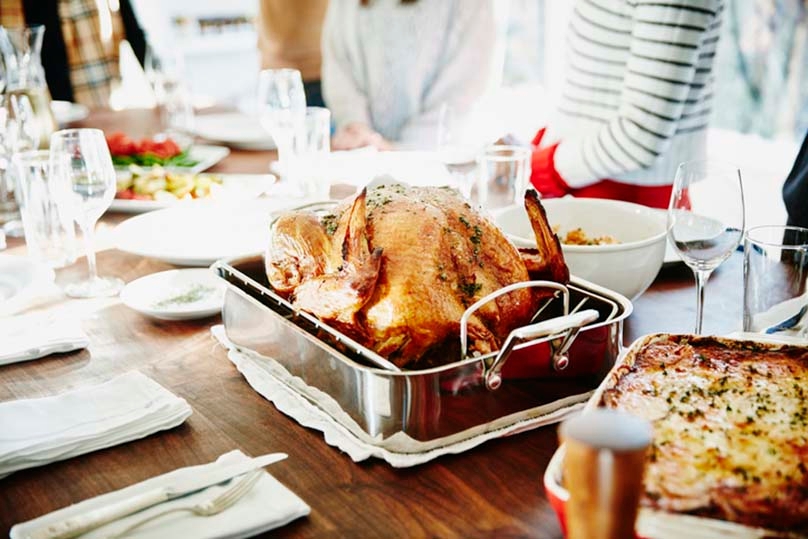 Christmas dinner dishes, turkey and casserole on dinner table